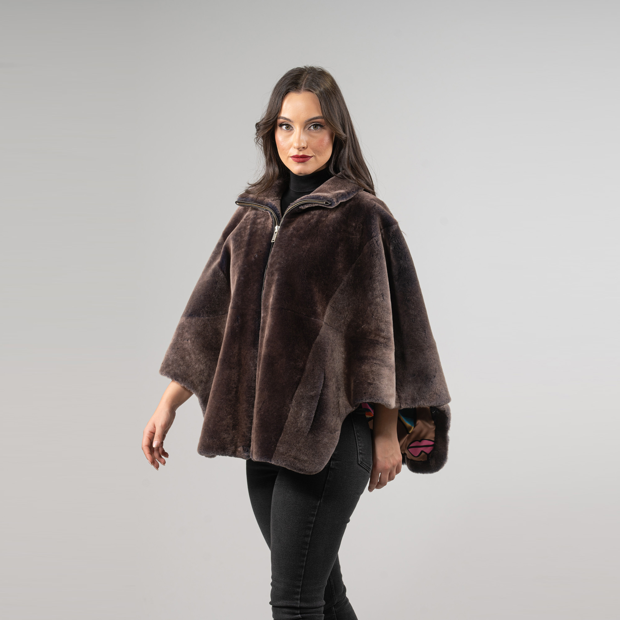 Sheepskin cape in brown color