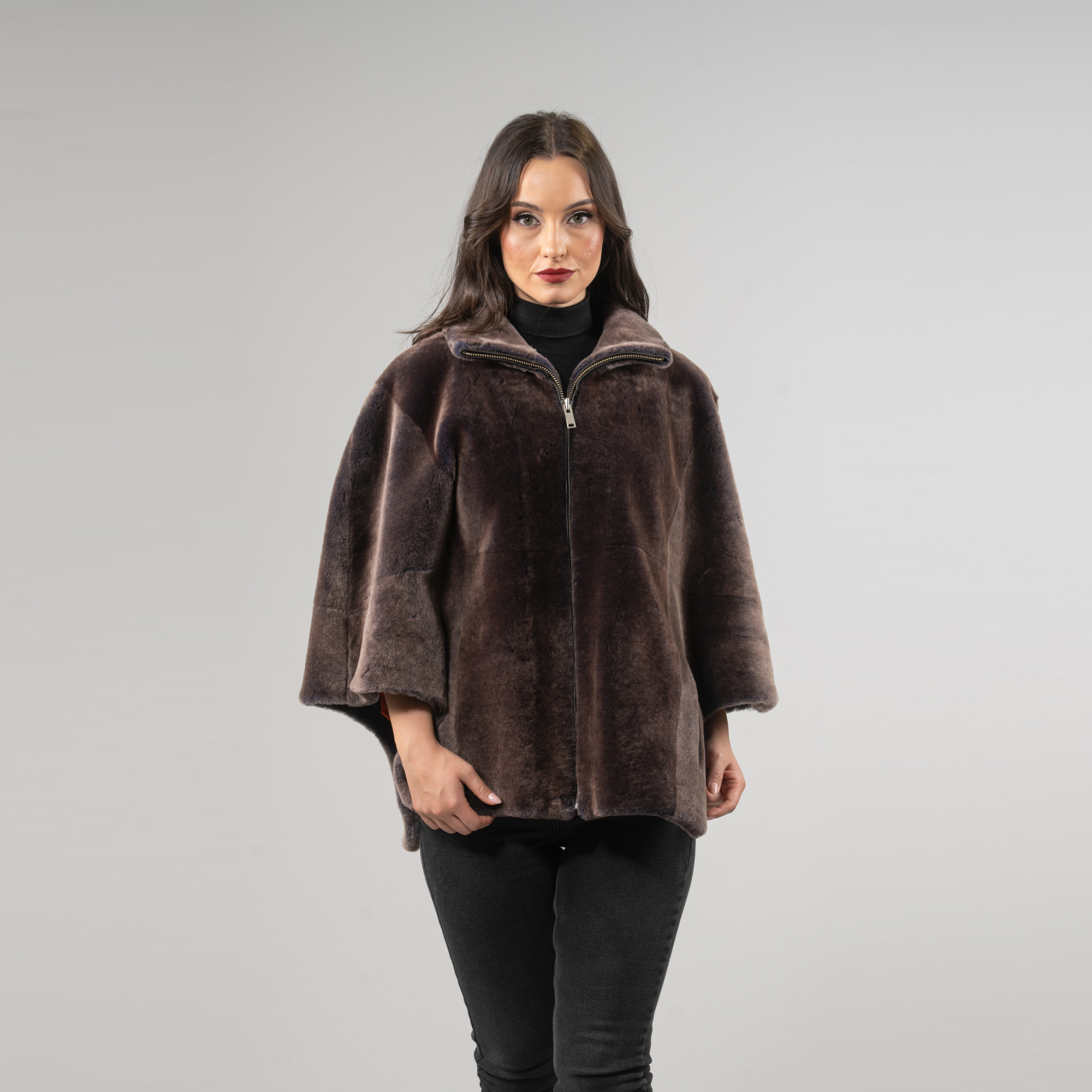 Sheepskin cape in brown color