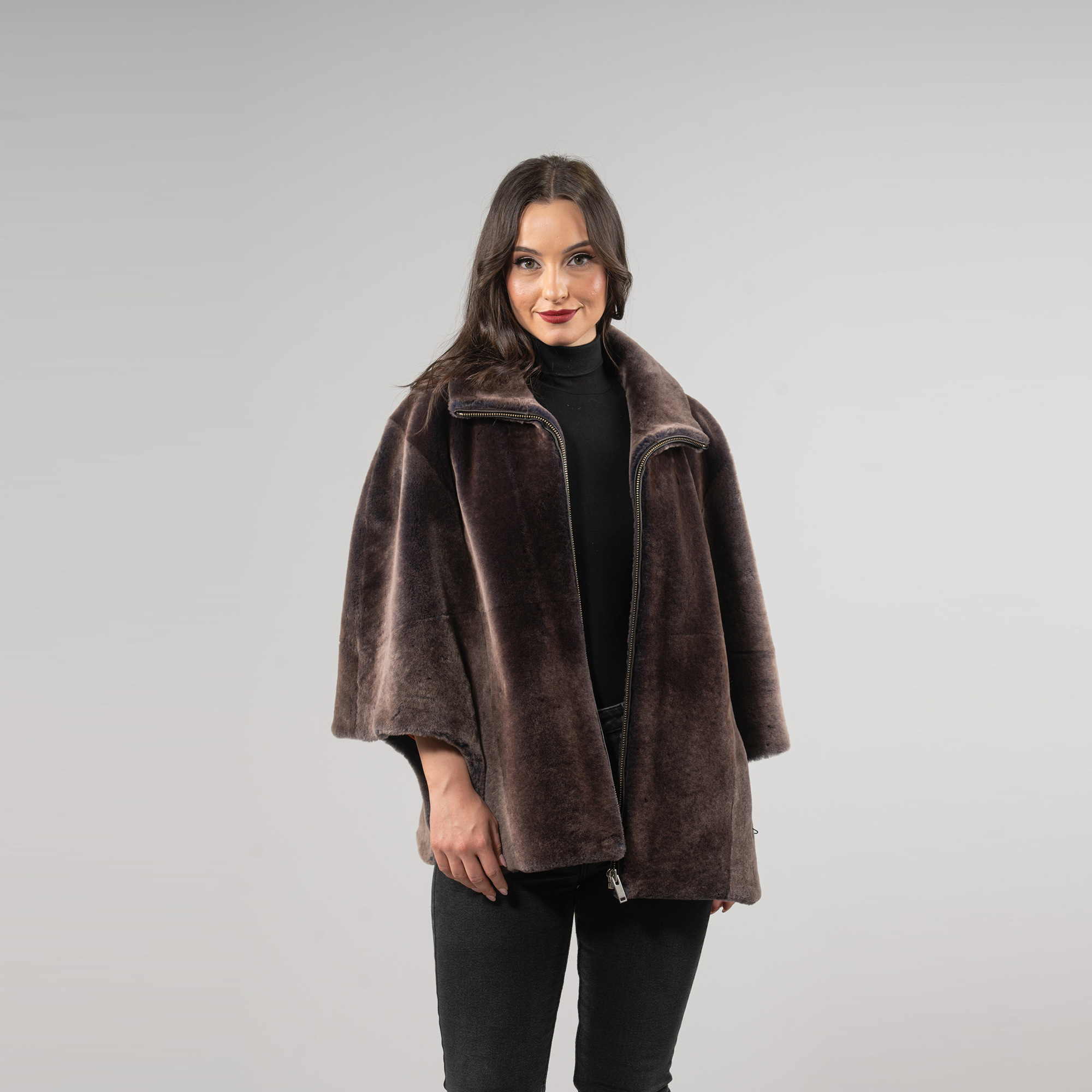 Sheepskin cape in brown color