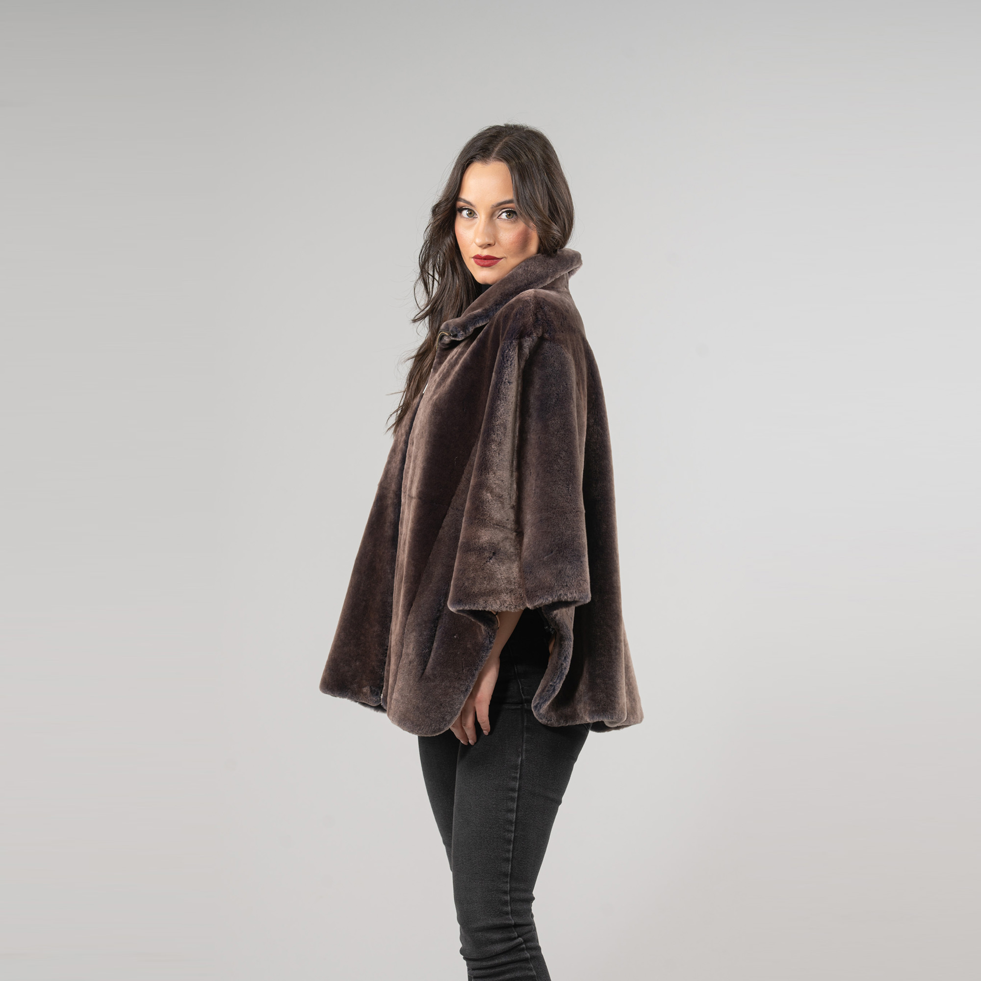 Sheepskin cape in brown color