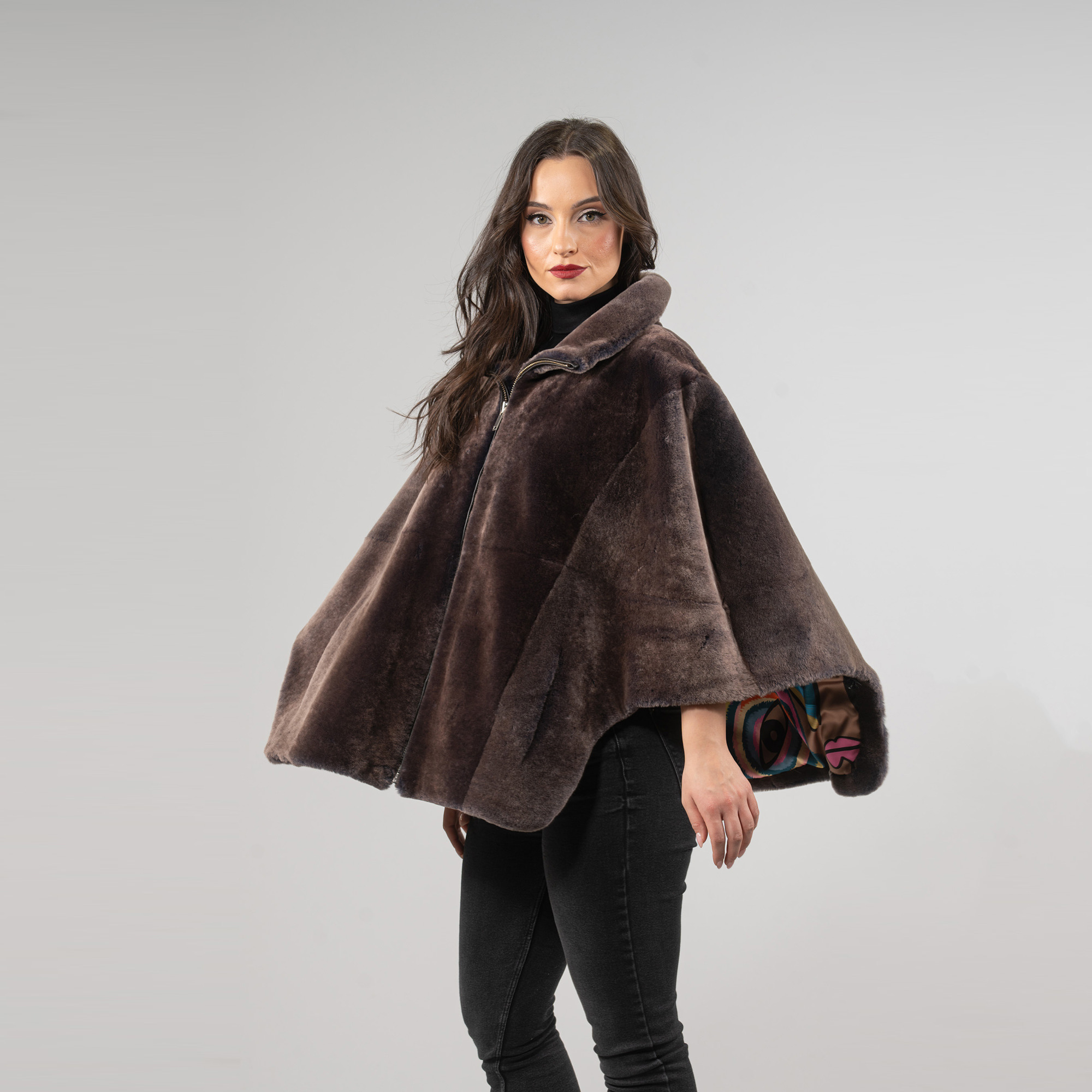 Sheepskin cape in brown color